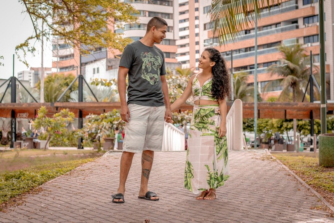 Two Brazilian coworkers shaking hands after resolving a discussion