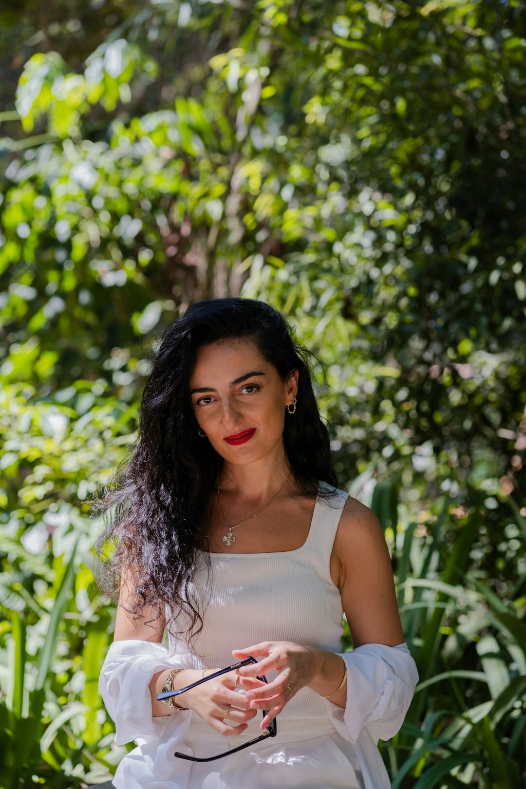 Brazilian woman confidently speaking and gesturing during a conversation outdoors